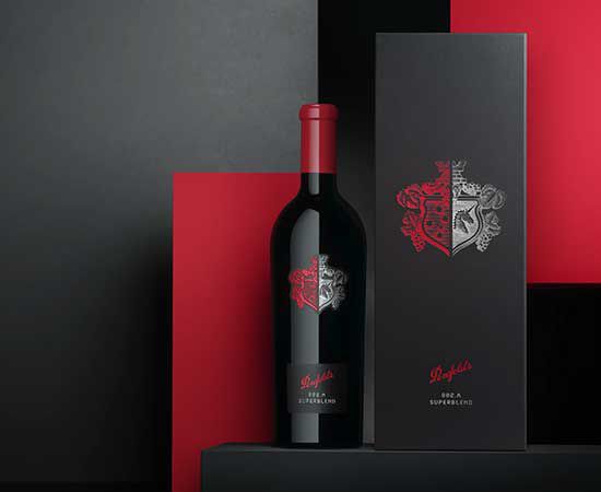 Penfolds Superblend 802-A bottle with black gift box against red and charcoal textured background