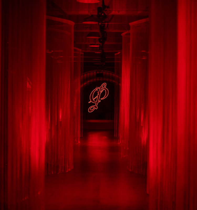 Penfolds logo amidst red lit room
