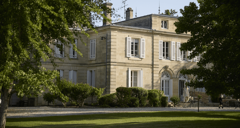 Chateau building visible between trees 