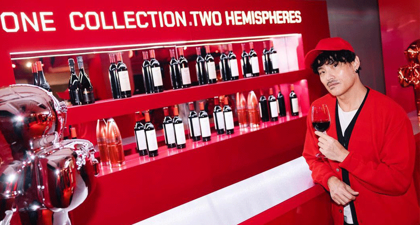 Guest poses with a glass of wine