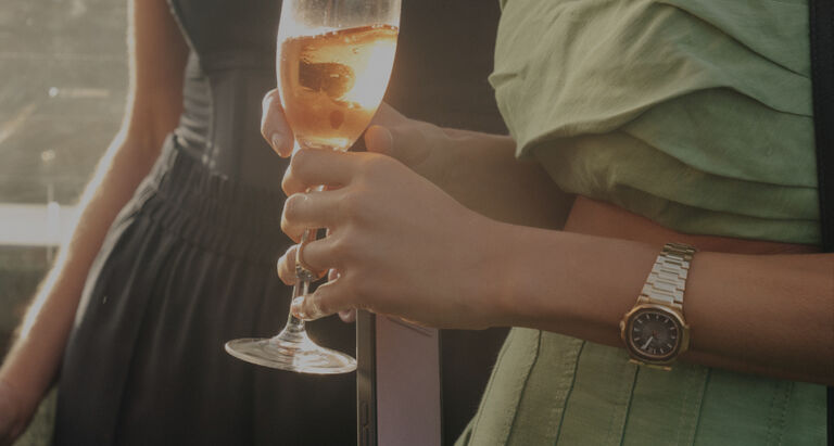 Two ladies drinking champagne