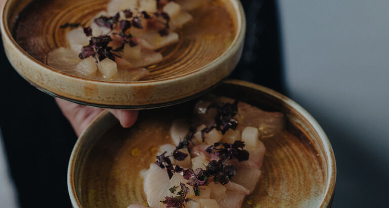Fish being served on a dish