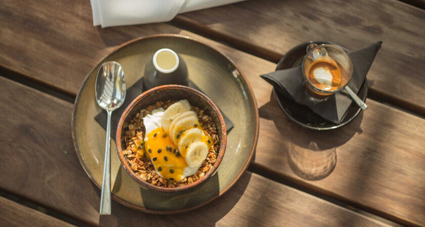 Magill Estate Kitchen breakfast muesli with fruit and an espresso shot overhead