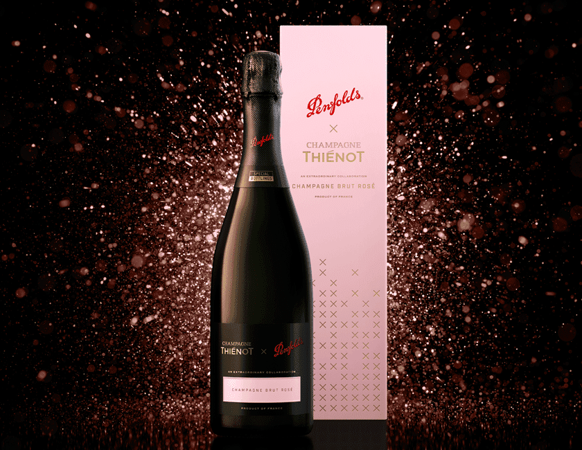 Penfolds Champagne Rose Bottle with pink sparkles behind