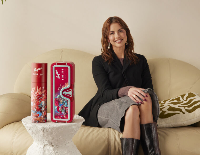 Mikaela Stafford on couch with venture beyond Bin 389