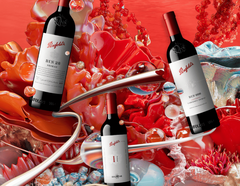 3 Penfolds Bottles Floating Against Coral