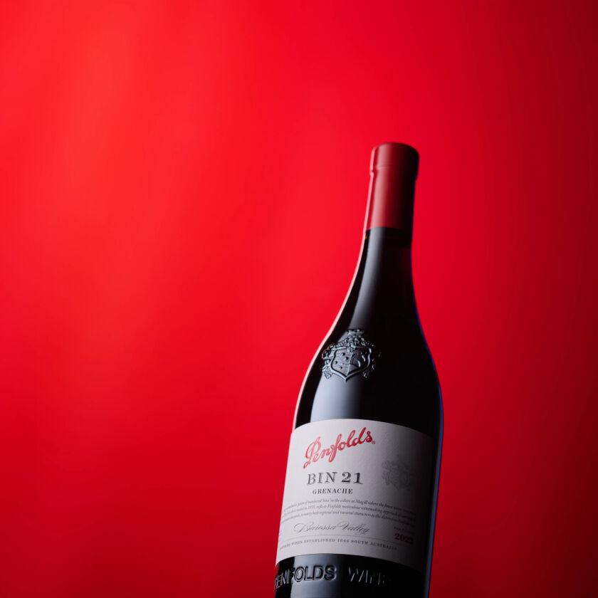 Bottle of Bin 21 Grenache in front of red background