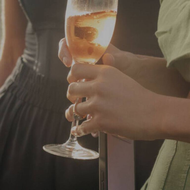 Two ladies drinking champagne