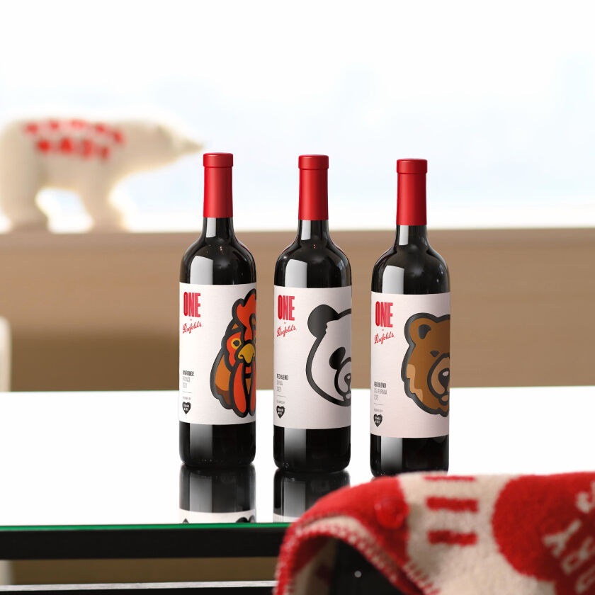 Three bottles on a table.  Each has coloured animal graphics